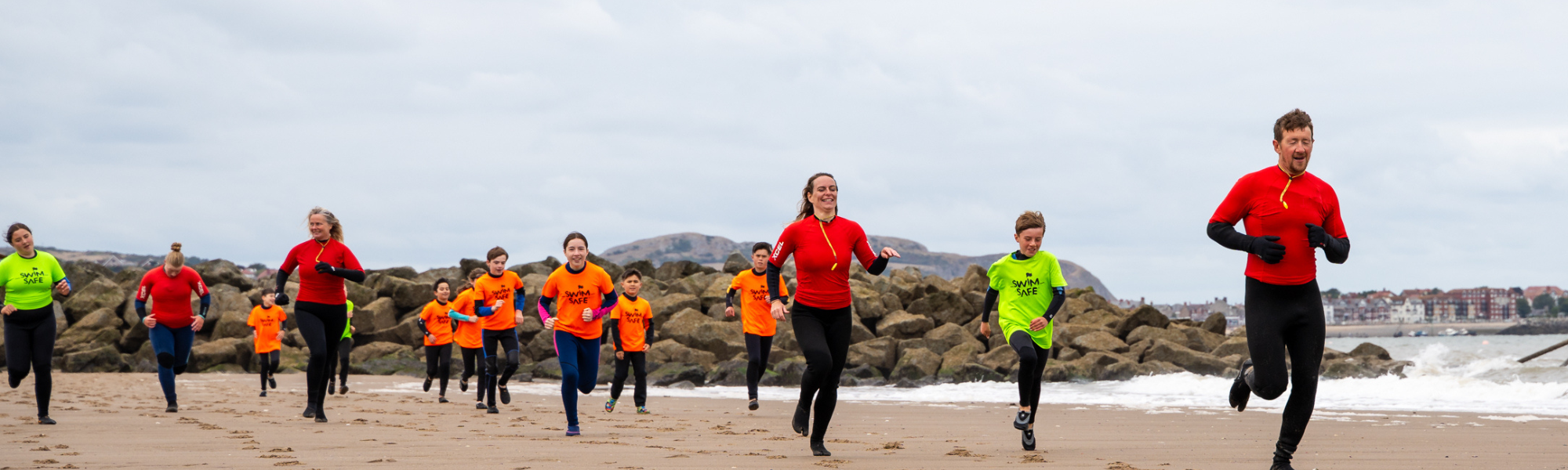Picture of people running on the beach