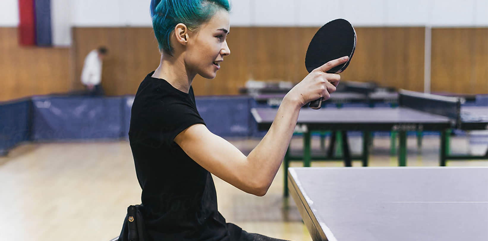 Person playing table tennis.