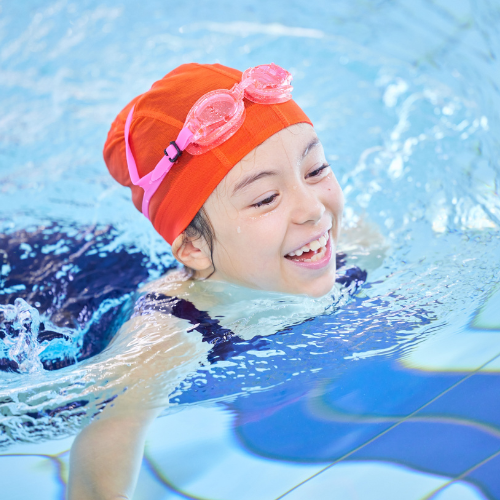 Young girl swimming in the pool