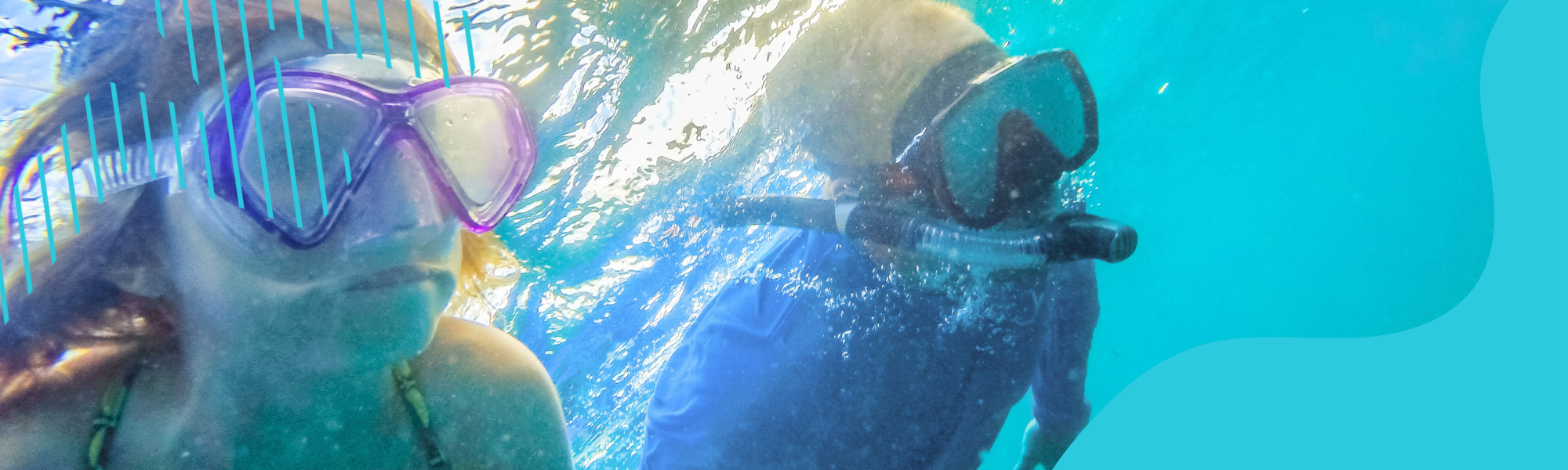 2 children swimming with snorkels on