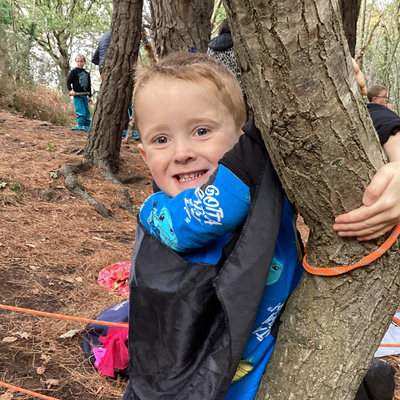 Picture of boy behind tree