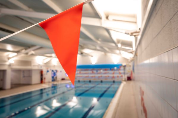 Flag with swimming pool in background.