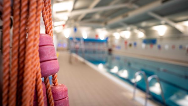 Bundle of rope with swimming pool in background.
