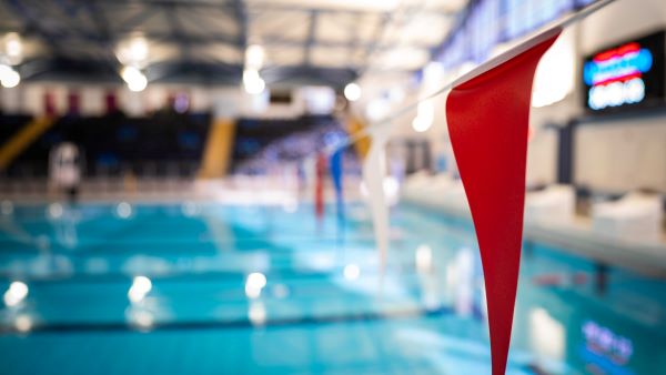 bunting flag above swimming pool water